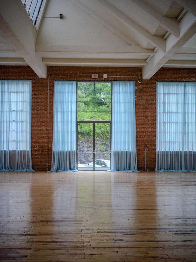 Light Through Sheer Curtains in Industrial Gallery