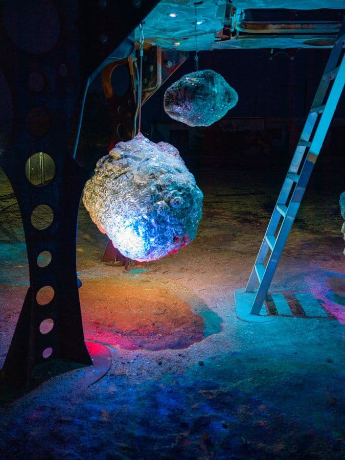 Ladder and Luminous Rock Sculpture, Desert Night