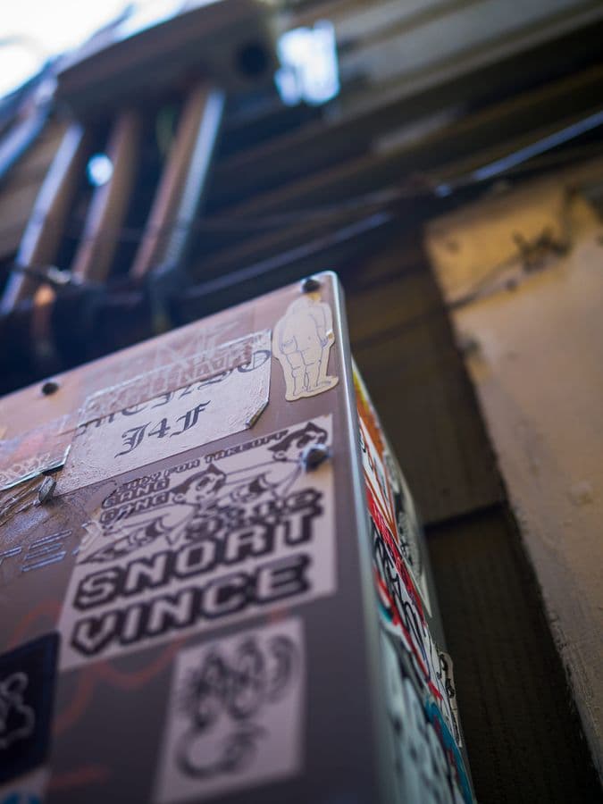 Snort Vince Newspaper Box on Urban Sidewalk